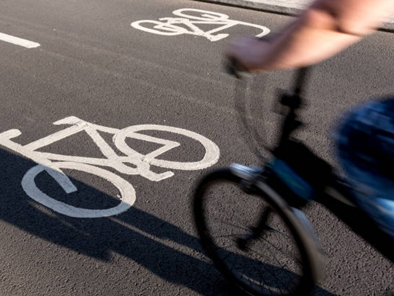 a bike path symbol on the road